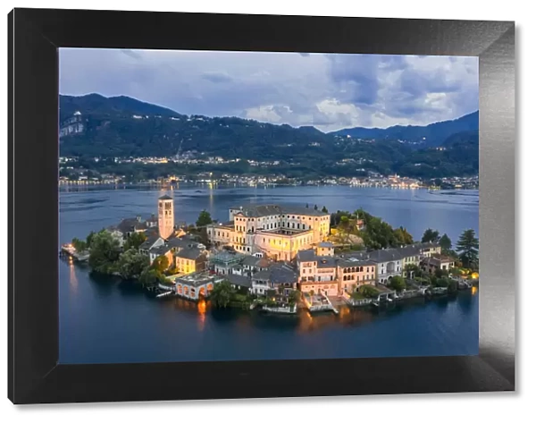 Aerial view of Orta San Giulio and Lake Orta at blu hour before a storm. Orta Lake