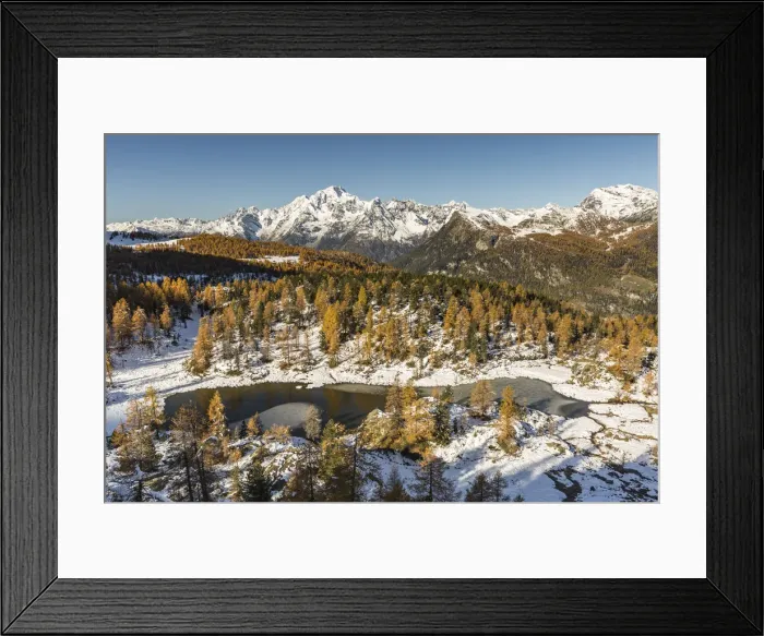 Framed Print : Aerial view of Mufule Lake and Mount Disgrazia surrounded by autumnal larches and snow Framed Print : Aerial view of Mufule Lake and Mount Disgrazia surrounded by autumnal larches and snow