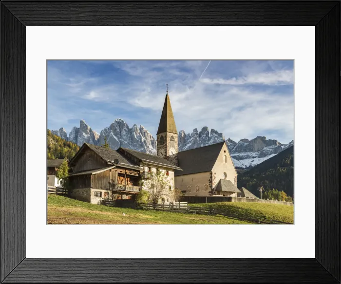 Framed Print : Typical houses and the church of the village with Odle Dolomites peaks on the background Framed Print : Typical houses and the church of the village with Odle Dolomites peaks on the background