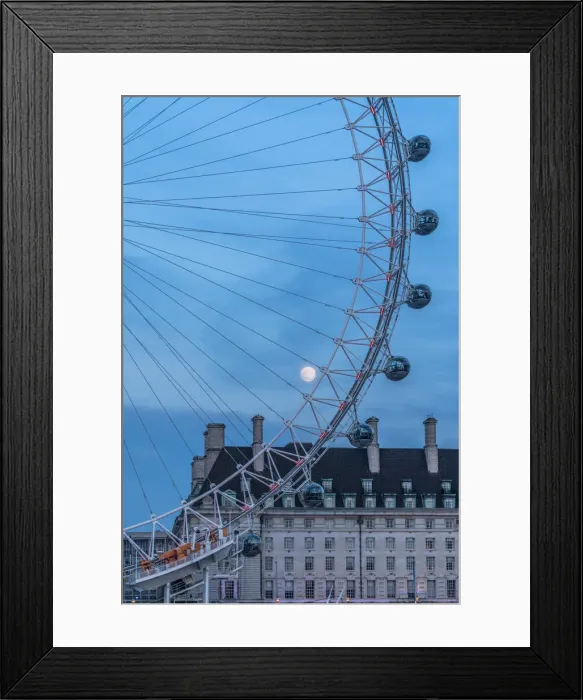 Framed Print : Details of London Eye ferris wheel with County Hall in background under the full moon Framed Print : Details of London Eye ferris wheel with County Hall in background under the full moon