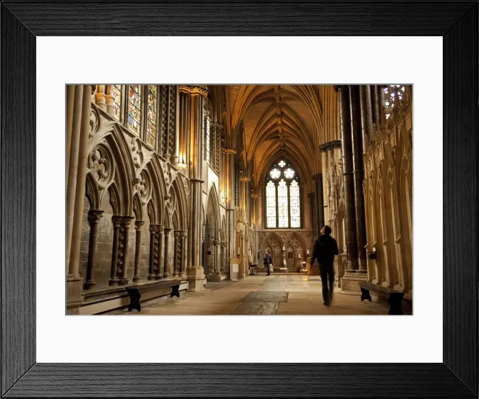 Framed Print : Lincoln, England. A visitor gazes at the medieval stained glass in Lincoln cathedral Framed Print : Lincoln, England. A visitor gazes at the medieval stained glass in Lincoln cathedral