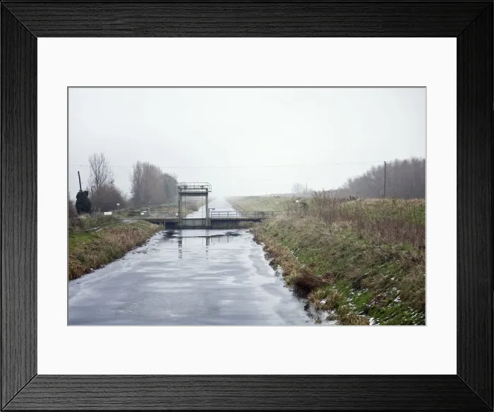 Framed Print : Welney, Cambridgeshire, UK. A frozen drainage ditch attracts skaters Framed Print : Welney, Cambridgeshire, UK. A frozen drainage ditch attracts skaters