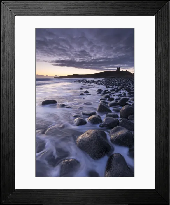 Framed Print : Sunrise at Embleton Bay boulder beach with Dunstanburgh Castle beyond, Northumberland Framed Print : Sunrise at Embleton Bay boulder beach with Dunstanburgh Castle beyond, Northumberland