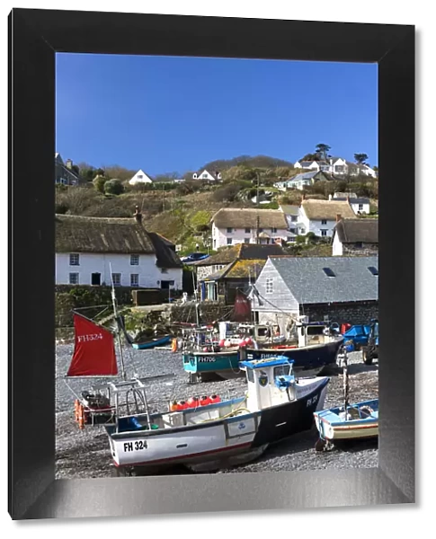 Fishing boats pulled onshore in the pretty Cornish fishing village of Cadgwith, Cornwall