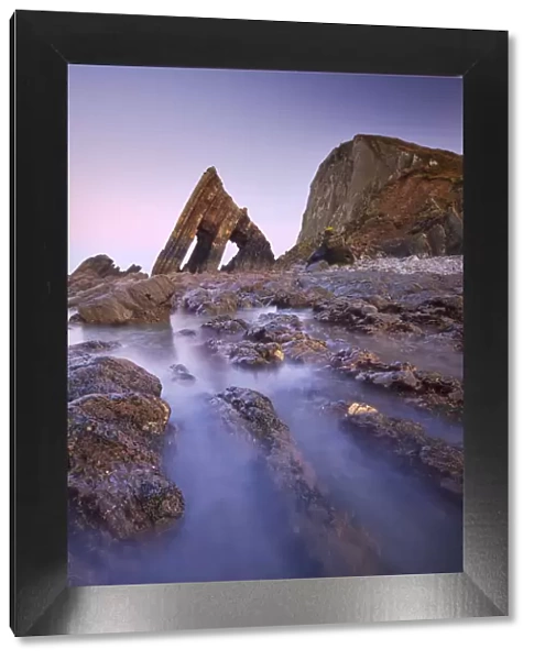Blackchurch Rock and rocky ledges at twilight, Mouthmill Beach, North Devon, England
