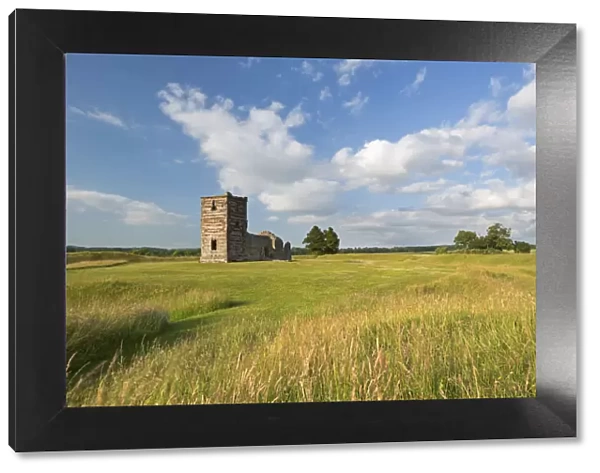 The ruins of Knowlton Church surrounded by countryside, Dorset, England. Summer (July)
