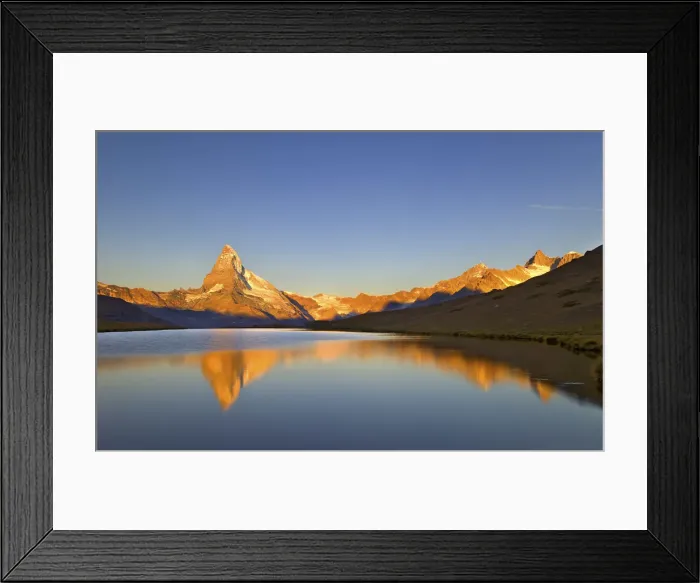 Framed Print : Placid alpine lake thats reflecting the Matterhorn in the golden light of sunrise Framed Print : Placid alpine lake thats reflecting the Matterhorn in the golden light of sunrise