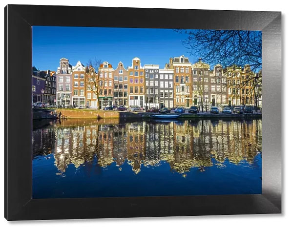 Amsterdam, Netherlands, Europe. Traditional old buildings reflected in the canal