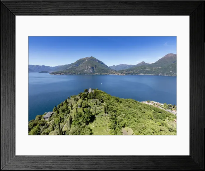Framed Print : Aerial view of the green hill and castle overlooking Varenna surrounded by Lake Como Framed Print : Aerial view of the green hill and castle overlooking Varenna surrounded by Lake Como