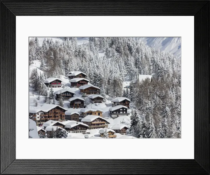 Framed Print : The snowy woods frame the typical mountain huts Bettmeralp district of Raron canton Framed Print : The snowy woods frame the typical mountain huts Bettmeralp district of Raron canton
