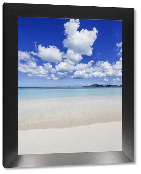 Blue sky frames the white sand and the turquoise Caribbean sea Ffryers Beach Antigua