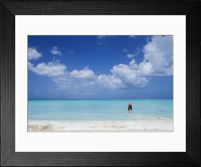 Framed Print : A bather with a pink hat in the turquoise waters of the Caribbean Sea The Nest Antigua