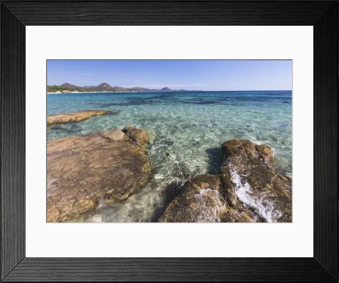 Framed Print : Rocks frame the turquoise water of sea around the sandy beach of Sant Elmo Castiadas Framed Print : Rocks frame the turquoise water of sea around the sandy beach of Sant Elmo Castiadas
