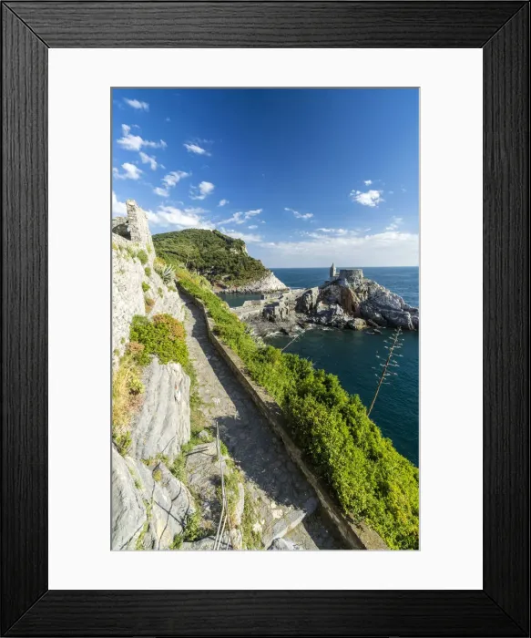 Framed Print : Green plants frame the old castle and church perched on the promontory Portovenere Framed Print : Green plants frame the old castle and church perched on the promontory Portovenere