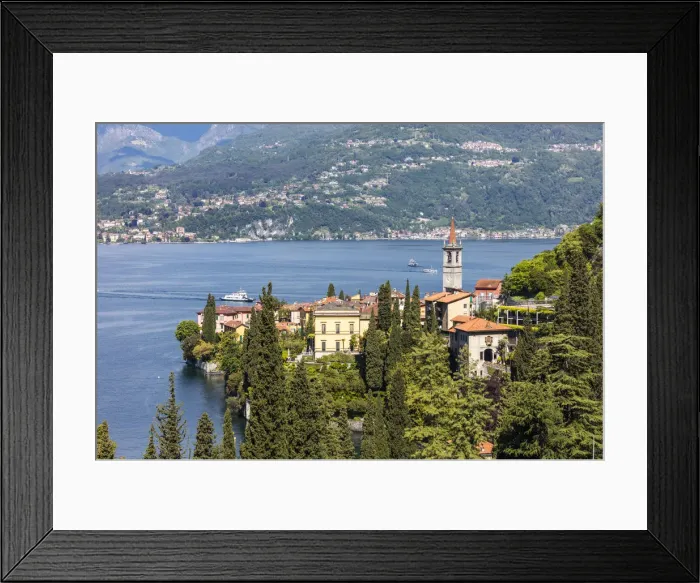 Framed Print : The typical village of Varenna surrounded by the blue water of Lake Como and gardens Framed Print : The typical village of Varenna surrounded by the blue water of Lake Como and gardens