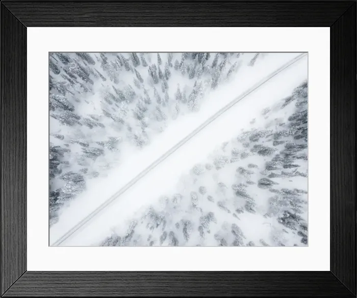 Framed Print : Aerial view of road in the snow covered forest, Pallas-Yllastunturi National Park Framed Print : Aerial view of road in the snow covered forest, Pallas-Yllastunturi National Park