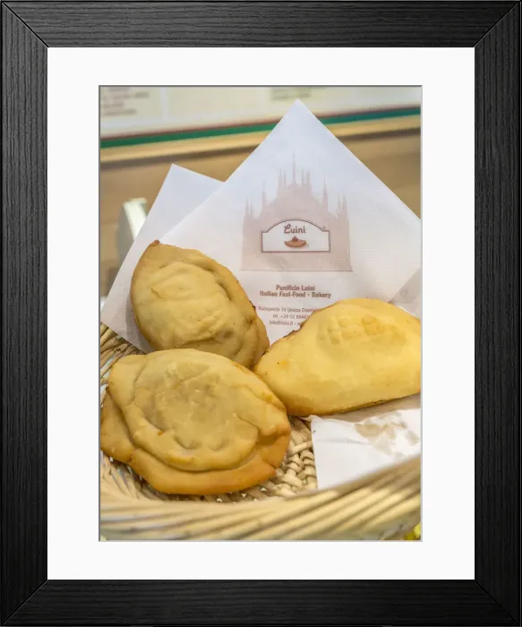 Framed Print : The typical milanese homemade Panzerotti at the old Luini bakery an icon of Milan