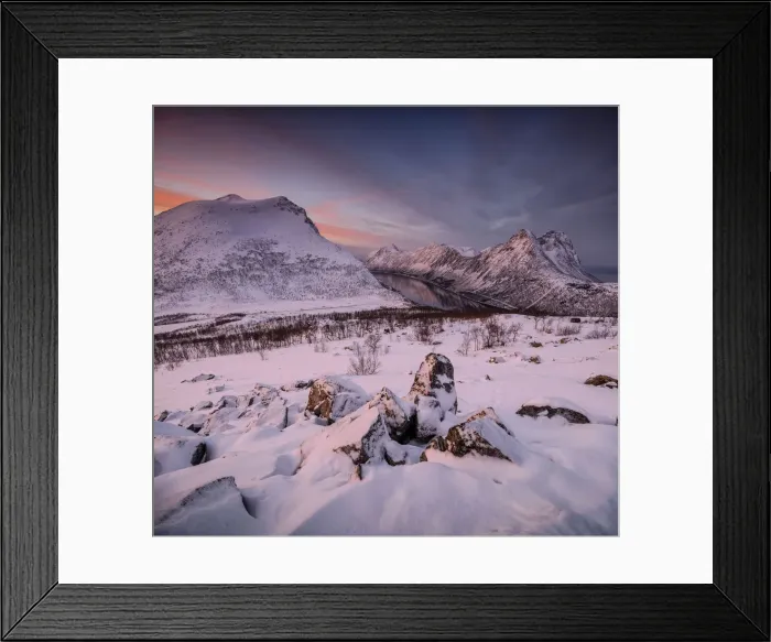 Framed Print : Panorama of snowy peaks surrounded by frozen sea under orange clouds at sunset Framed Print : Panorama of snowy peaks surrounded by frozen sea under orange clouds at sunset