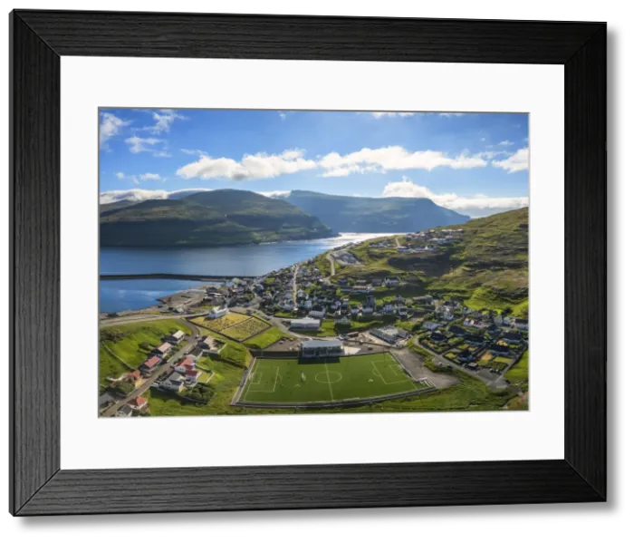 Framed Print : Panoramic aerial view of soccer field in the village of Eidi, Eysturoy island, Faroe Framed Print : Panoramic aerial view of soccer field in the village of Eidi, Eysturoy island, Faroe