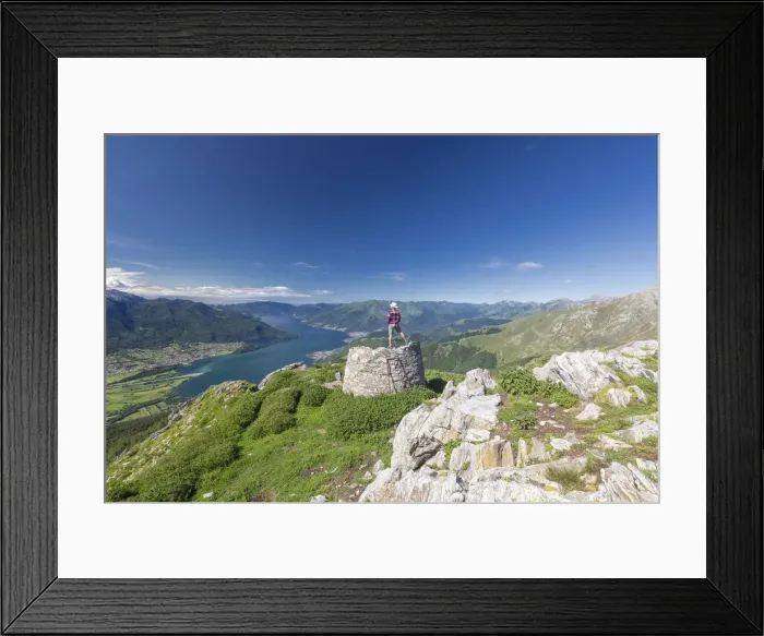 Framed Print : Hiker on summit of Monte Berlinghera looks towards Lake Como, Sondrio province, Lombardy Framed Print : Hiker on summit of Monte Berlinghera looks towards Lake Como, Sondrio province, Lombardy