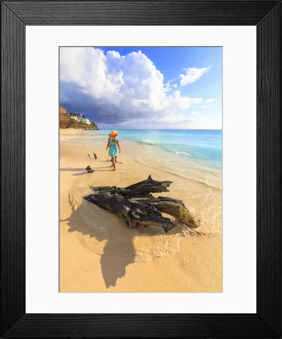 Framed Print : Rear view of woman with hat walking on Ffryes Beach, Antigua, Antigua and Barbuda