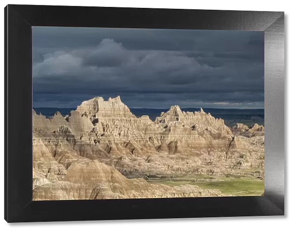 The eroded rocky formations of the Badlands region in South Dakota under a threatening