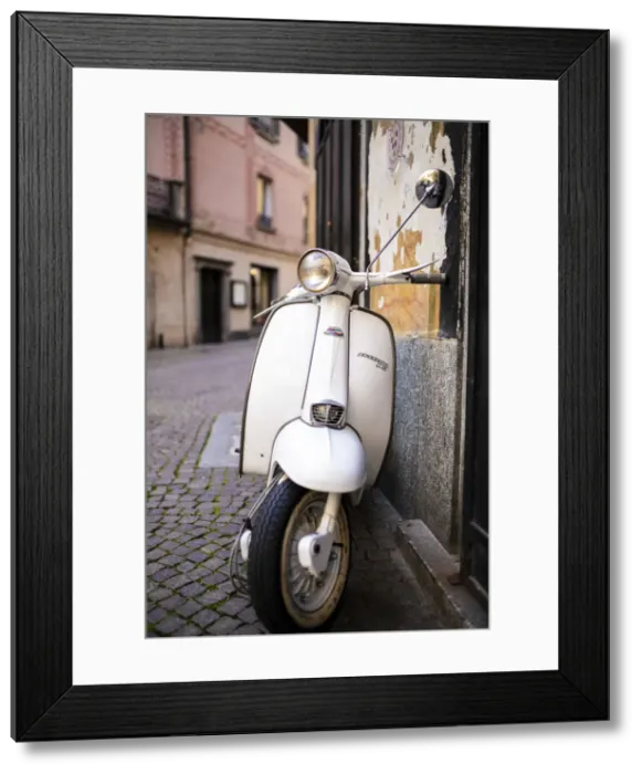 Framed Print : Lambretta Innocenti scooter in the old alley, Morbegno, province of Sondrio, Valtellina