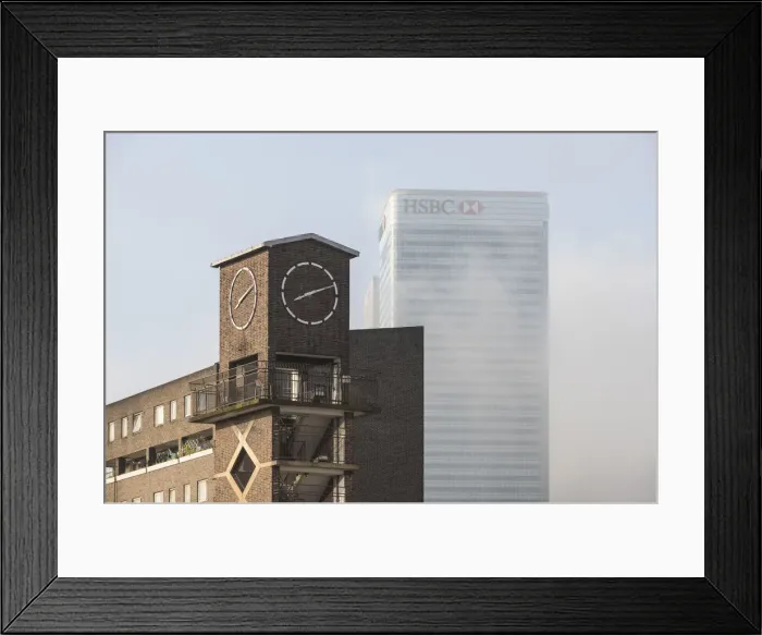 Framed Print : Chrisp Street Clock Tower with Canary Wharf in background, London, UK Framed Print : Chrisp Street Clock Tower with Canary Wharf in background, London, UK