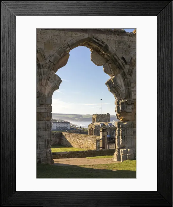 Framed Print : Ruined doorway of Whitby abbey frames the town, Whitby, North Yorkshire, England Framed Print : Ruined doorway of Whitby abbey frames the town, Whitby, North Yorkshire, England