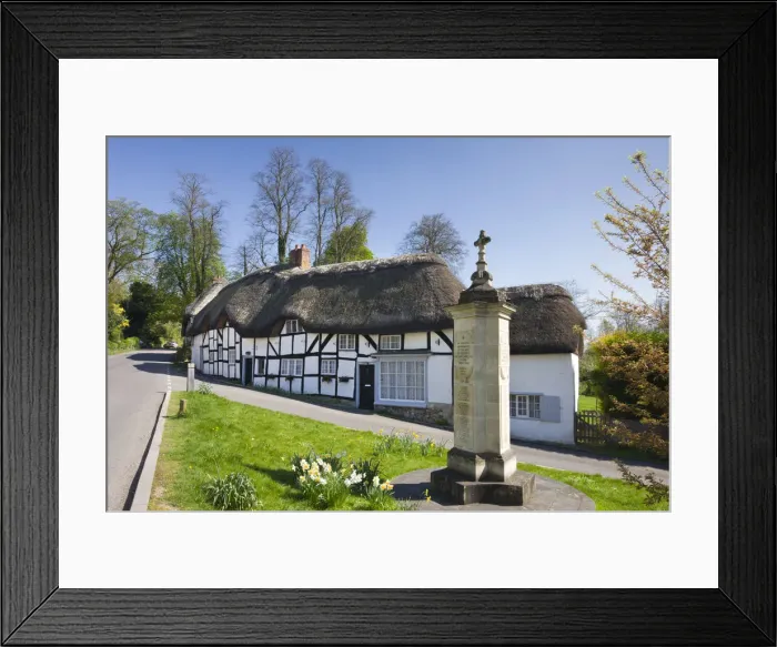 Framed Print : Thatched cottages and war memorial in the village of Wherwell, Hampshire, England Framed Print : Thatched cottages and war memorial in the village of Wherwell, Hampshire, England