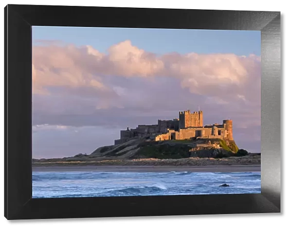 Late evening sunlight bathes against the Bamburgh Castle stronghold on the Northumberland