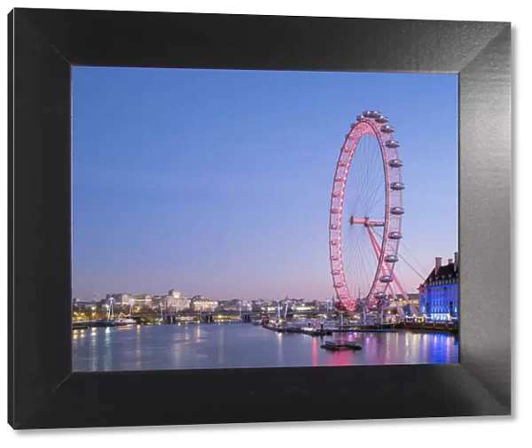 United Kingdom, England, London. London Eye observation wheel on the River Thames at dawn
