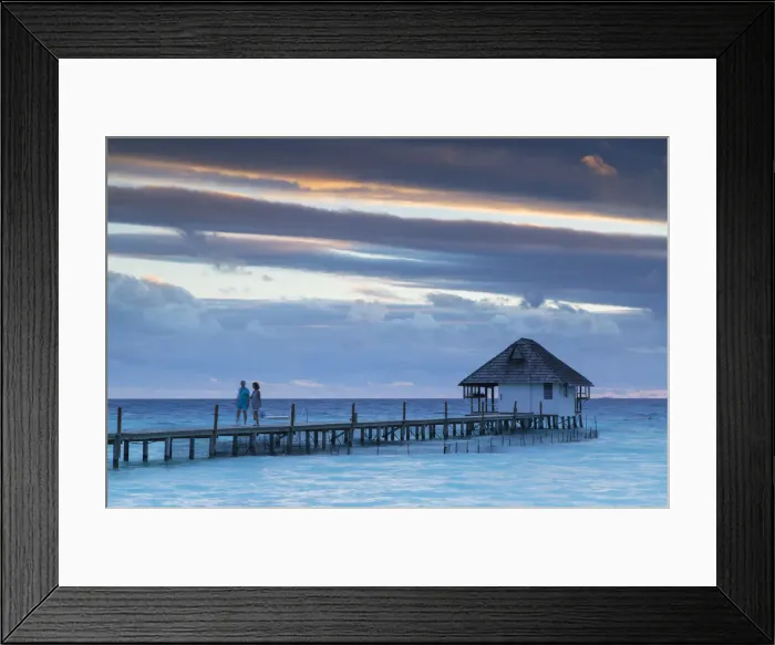 Framed Print : Couple on jetty at sunset, Fakarava, Tuamotu Islands, French Polynesia Framed Print : Couple on jetty at sunset, Fakarava, Tuamotu Islands, French Polynesia