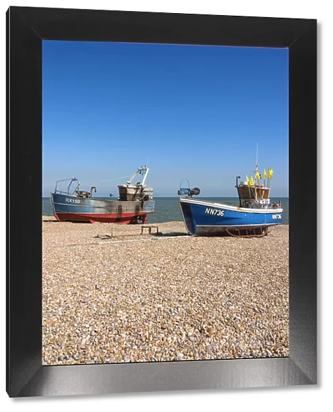 Traditional fishing boats on the shingle beach at Hastings, Sussex, England