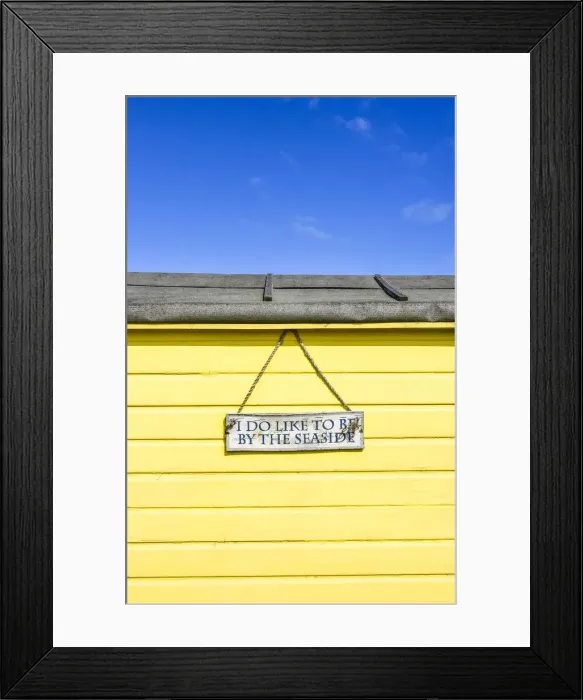 Framed Print : I do like to be beside the seaside traditional beach hut on Littlestone beach, Kent, England Framed Print : I do like to be beside the seaside traditional beach hut on Littlestone beach, Kent, England
