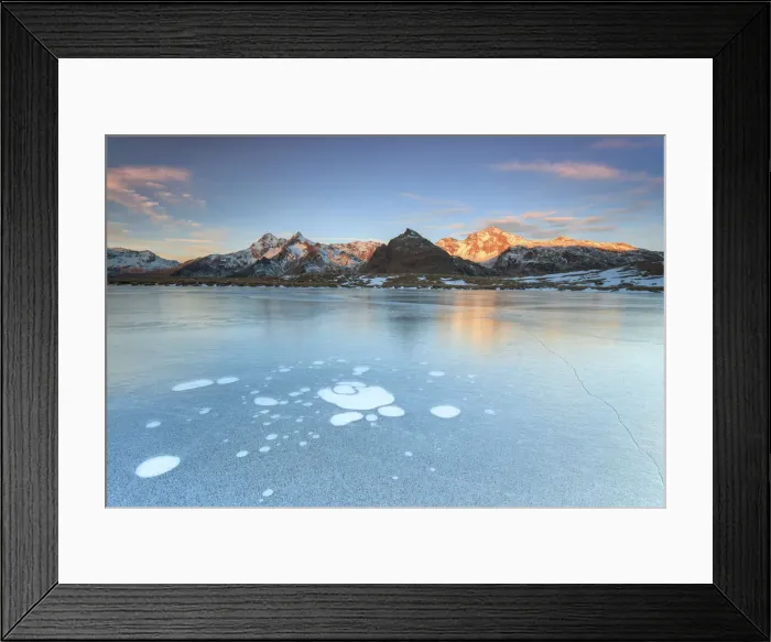 Framed Print : Ice bubbles on the frozen surface of Andossi Lake at sunrise Spluga Valley Valtellina