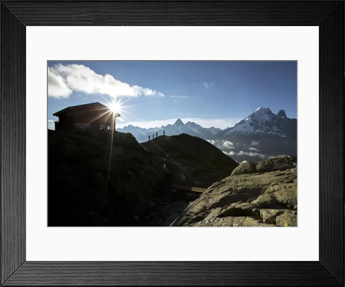 Framed Print : Hikers leave the Refuge Lac De Cheserys to venture on the paths at high altitude Chamonix
