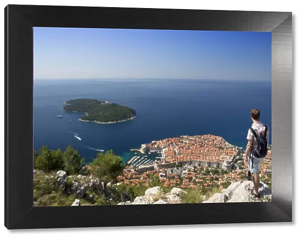 Europe, Croatia, Dalmatia, Dubrovnik, a tourist looking out over the historic centre