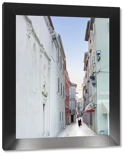 Europe, Croatia, Dalmatia, Zadar, a nun walking along a street in the historic centre