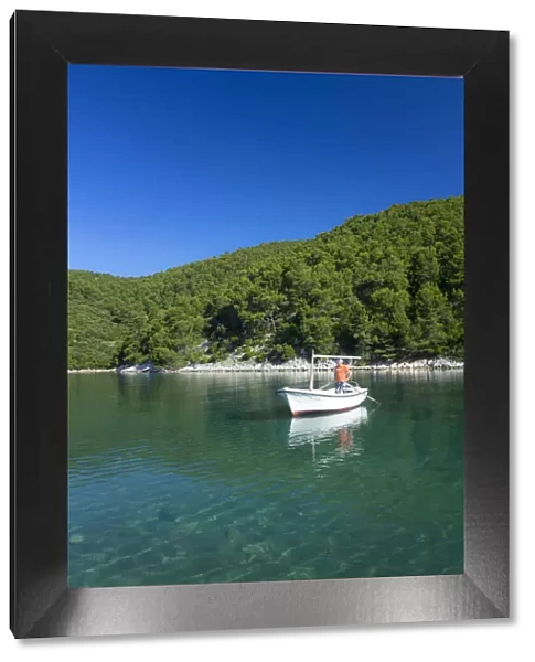 Europe, Croatia, Dalmatia, Korcula, local fisherman moored in a woody inlet on the