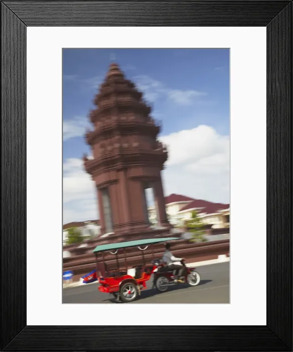 Framed Print : Tuk tuk passing Independence Monument, Phnom Penh, Cambodia Framed Print : Tuk tuk passing Independence Monument, Phnom Penh, Cambodia