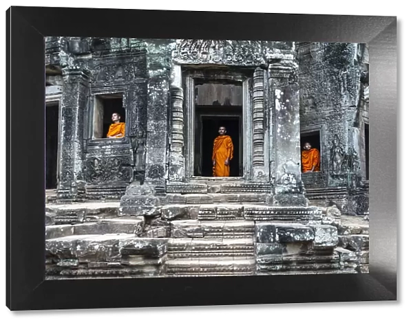 Cambodia, Siem Reap, Angkor Wat complex. Monks inside Bayon temple (MR)