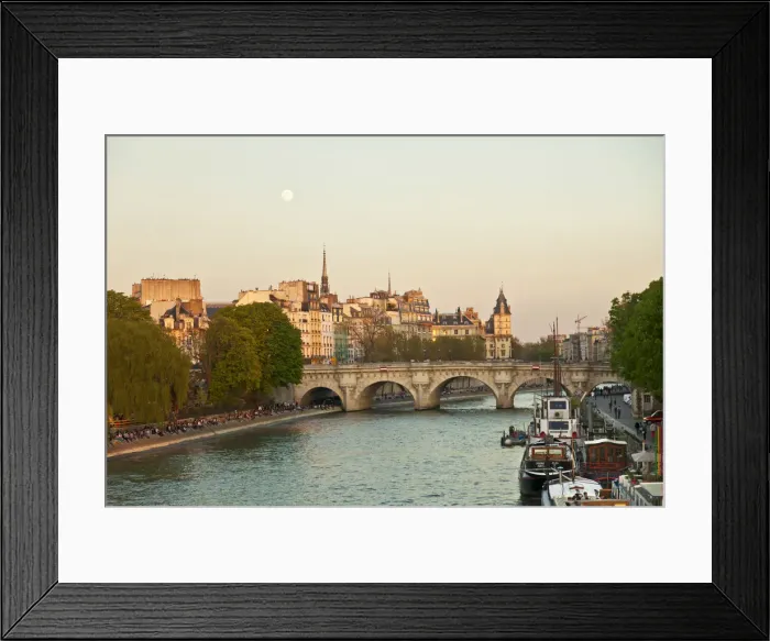 Framed Print : Paris, France. Locals enjoy a spring evening by the river Seine
