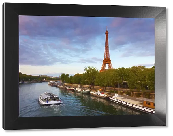 France, Paris, Eiffel Tower and tourist boat on River Seine