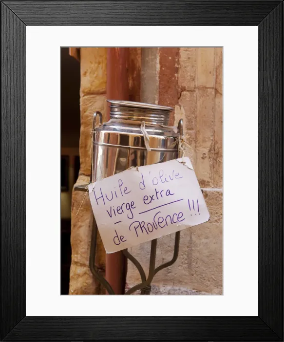 Framed Print : Rousillion; France. A hand made sign on a can of virgin olive oil for sale in Provence Framed Print : Rousillion; France. A hand made sign on a can of virgin olive oil for sale in Provence