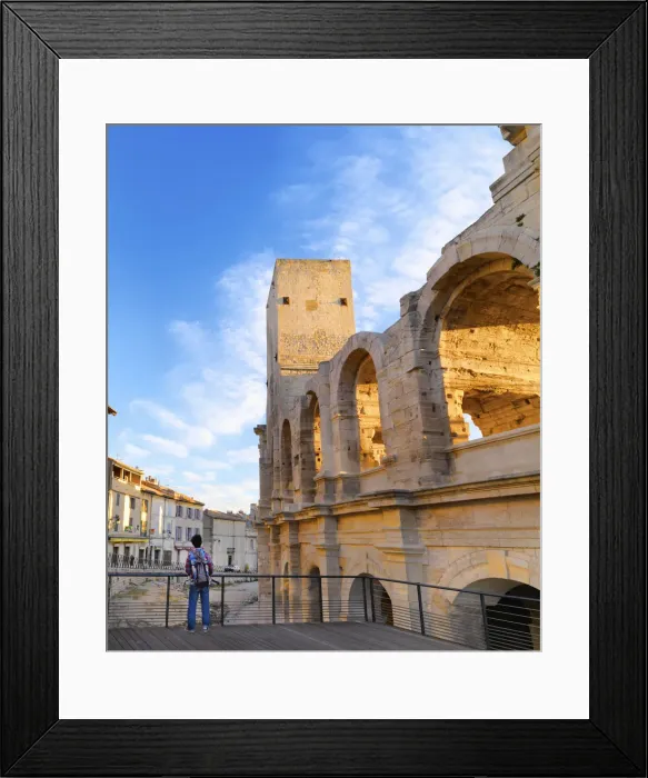 Framed Print : France, Provence, Arles, Man looking towards Roman Amphitheatre. MR