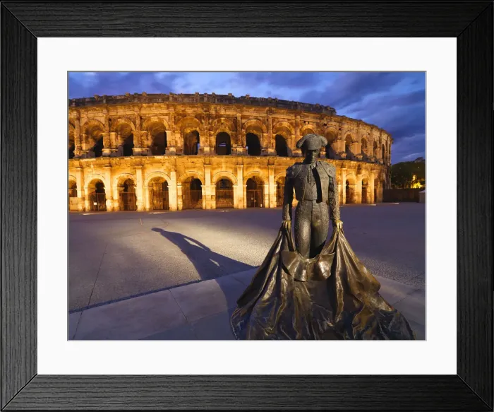 Framed Print : France, Provence, Nimes, Roman ampitheatre, Toreador statue at dusk Framed Print : France, Provence, Nimes, Roman ampitheatre, Toreador statue at dusk