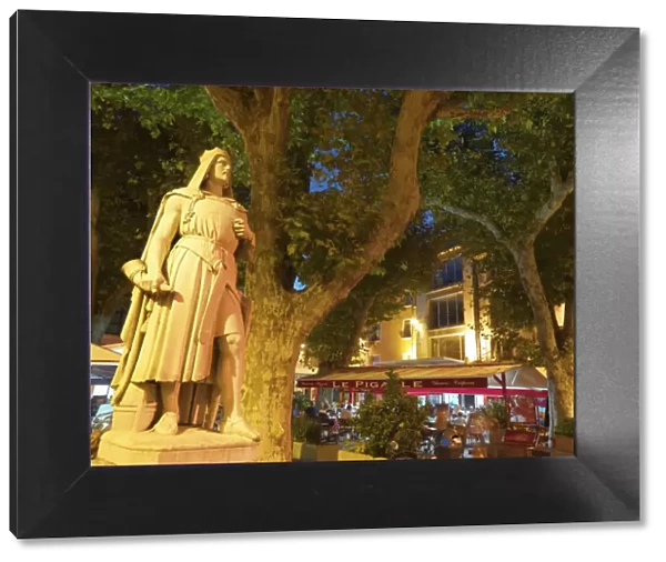 France, Provence, Orange, Place de la Republic, Rimbaud 11 statue at dusk