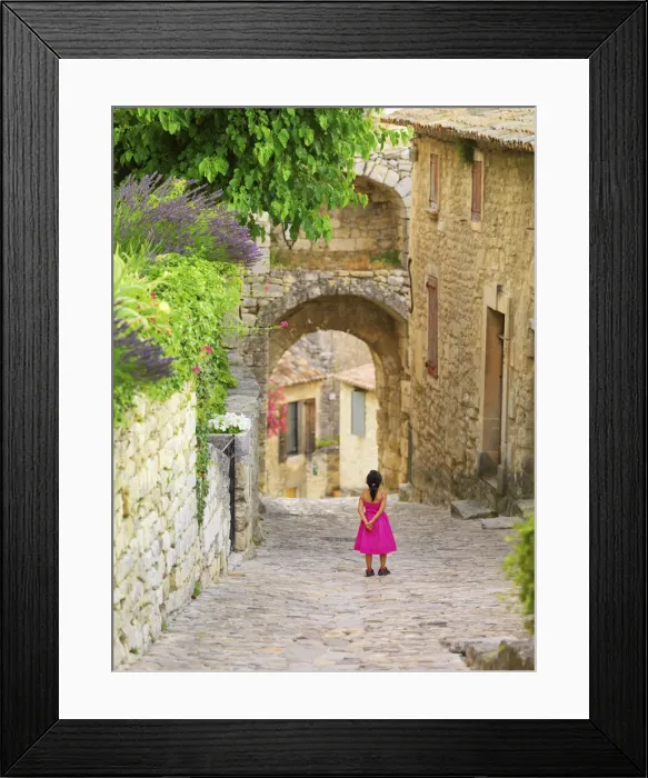Framed Print : France, Provence, Lacoste, view along cobbled street in village (MR) Framed Print : France, Provence, Lacoste, view along cobbled street in village (MR)