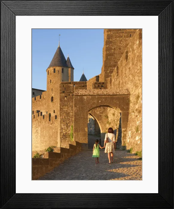 Framed Print : France, Languedoc, Carcassonne, Woman and girl walking to Aude gate (MR)